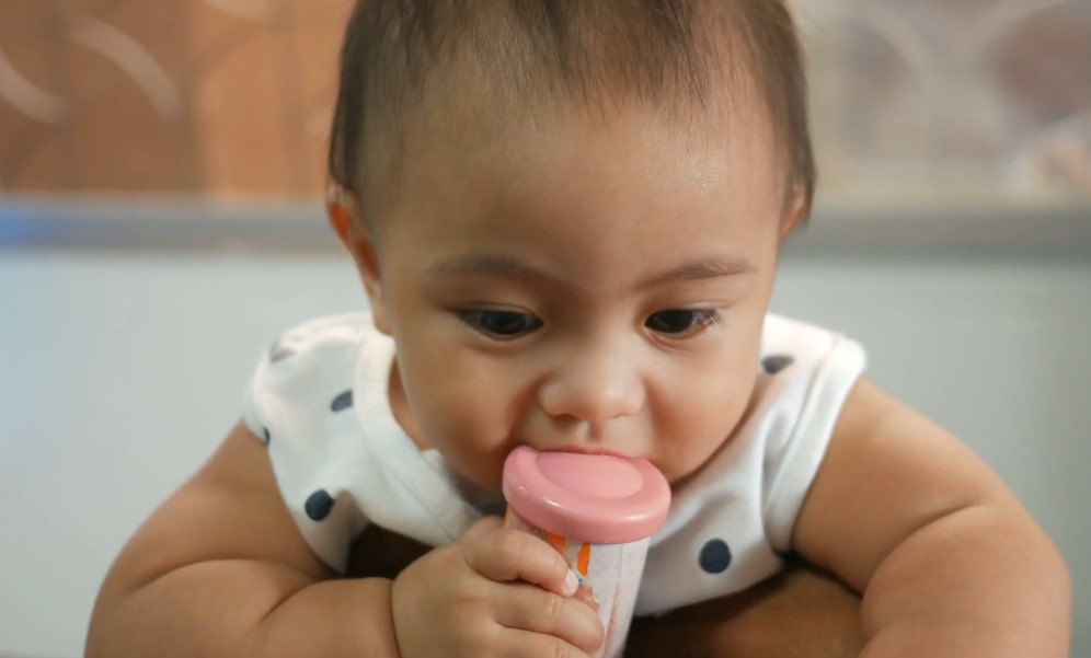 Baby playing with a toy